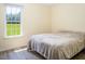Bedroom with large window and full-size bed at 1416 Chambers Rd, Rougemont, NC 27572