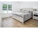 Main bedroom with king-size bed and large window at 1416 Chambers Rd, Rougemont, NC 27572