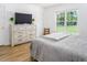 Bedroom with king-size bed and large window at 1416 Chambers Rd, Rougemont, NC 27572