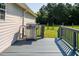 Side deck with grill and access to backyard at 1416 Chambers Rd, Rougemont, NC 27572