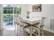 Bright dining area with white table and chairs at 1416 Chambers Rd, Rougemont, NC 27572