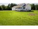 House exterior showcasing a gray vinyl sided home with a spacious lawn at 1416 Chambers Rd, Rougemont, NC 27572