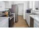 Modern kitchen with stainless steel appliances at 1416 Chambers Rd, Rougemont, NC 27572