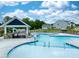 Community pool with multiple seating areas and a covered pavilion at 223 Augusta Pond Way # 158, Raleigh, NC 27603