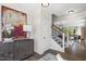 Entryway with statement art, wood cabinet, and view to the living room at 223 Augusta Pond Way # 158, Raleigh, NC 27603