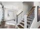 Bright entryway with hardwood floors, modern staircase, and large mirror at 223 Augusta Pond Way # 158, Raleigh, NC 27603