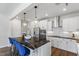 Modern kitchen with white cabinets, stainless steel appliances, and dark countertops at 223 Augusta Pond Way # 158, Raleigh, NC 27603