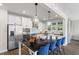 Modern kitchen with white cabinets, stainless steel appliances, and an island at 223 Augusta Pond Way # 158, Raleigh, NC 27603