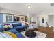 Spacious living room featuring a sectional sofa and large artwork at 223 Augusta Pond Way # 158, Raleigh, NC 27603