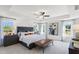 Large main bedroom with a king-size bed and plenty of natural light at 223 Augusta Pond Way # 158, Raleigh, NC 27603