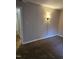 Spacious carpeted bedroom with neutral walls and doors at 7030 Longstreet Dr # A, Raleigh, NC 27615