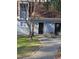 Brick front of a condo with a walkway and landscaping at 7030 Longstreet Dr # A, Raleigh, NC 27615