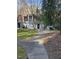 Exterior view of a charming townhouse with a well-maintained lawn at 7030 Longstreet Dr # A, Raleigh, NC 27615