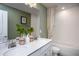 Bathroom with double vanity, white tile, and a bathtub at 773 Denburn Pl, Raleigh, NC 27603