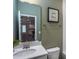 Small bathroom with single vanity and view to kitchen at 773 Denburn Pl, Raleigh, NC 27603