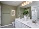 Elegant bathroom with double vanity and a large mirror at 773 Denburn Pl, Raleigh, NC 27603