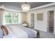 Spacious bedroom with large windows and a cozy sitting area at 773 Denburn Pl, Raleigh, NC 27603