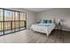 Bright bedroom with a queen-size bed and sliding door to balcony at 12 Beech Tree Vlg, Sanford, NC 27332