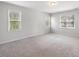 Bright bedroom with two windows and carpet flooring at 144 Pascoli Ct, Clayton, NC 27527