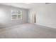 Bright bedroom featuring carpeted floors and an ensuite bathroom at 144 Pascoli Ct, Clayton, NC 27527