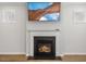 Gas fireplace with modern mantel and hearth at 144 Pascoli Ct, Clayton, NC 27527