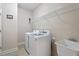 Laundry room with washer, dryer, shelving and a sink at 1675 Winter Wren Cir, Wake Forest, NC 27587