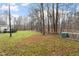 Large backyard with trees and a chicken coop at 1705 Old Nc 10 Hwy, Hillsborough, NC 27278