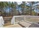 Wooden deck overlooking a wooded backyard at 174 Pine Needles Dr, Lillington, NC 27546