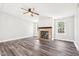 Living room with fireplace and wood-look flooring at 174 Pine Needles Dr, Lillington, NC 27546