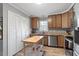 Updated kitchen featuring wood cabinets and a kitchen island at 1901 Milan St, Durham, NC 27704