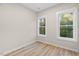 Well-lit bedroom with hardwood floors and large windows at 1917 A Essex, Durham, NC 27704