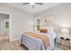 Bright bedroom with large windows, ceiling fan, and neutral decor at 1917 A Essex, Durham, NC 27704