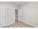 Bright bedroom with wood-look floors and access to another room at 1917 A Essex, Durham, NC 27704