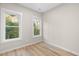 Spacious bedroom with two large windows and light wood floors at 1917 A Essex, Durham, NC 27704