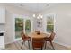 Charming dining area with wood table and leather chairs near sliding glass doors at 1917 A Essex, Durham, NC 27704