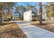 Two-story home with a large driveway and mature trees at 1917 A Essex, Durham, NC 27704