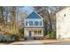 Two-story house with blue and beige siding, light blue door, and front porch at 1917 A Essex, Durham, NC 27704