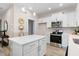 Modern kitchen featuring white cabinets and stainless steel appliances at 1917 A Essex, Durham, NC 27704