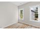 Bright bedroom with hardwood floors and two large windows at 1917B Essex Rd, Durham, NC 27704