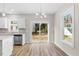 Kitchen dining area with hardwood floors and sliding glass doors at 1917 B Essex Rd, Durham, NC 27704