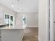 Bright kitchen with white cabinets, quartz countertops, and hardwood floors at 1917 B Essex Rd, Durham, NC 27704