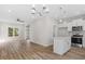 Open concept kitchen with island and stainless steel appliances at 1917 B Essex Rd, Durham, NC 27704