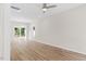 Spacious living room with hardwood floors and sliding glass doors at 1917 B Essex Rd, Durham, NC 27704