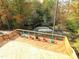 Elevated deck with colorful chairs overlooking a wooded area at 209 Big Bradley Dr, Wendell, NC 27591