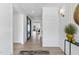 Bright and airy hallway with light hardwood floors and stylish decor at 209 Big Bradley Dr, Wendell, NC 27591