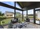 Relaxing screened porch with comfy seating overlooking the backyard at 209 Big Bradley Dr, Wendell, NC 27591