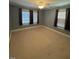 Spacious bedroom with carpet and ceiling fan at 209 N Watauga Ave, Dunn, NC 28334