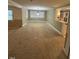 Large dining area with carpet flooring and natural light at 209 N Watauga Ave, Dunn, NC 28334