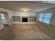 Living room featuring built-in shelving and a fireplace at 209 N Watauga Ave, Dunn, NC 28334