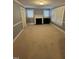 Spacious living room with a fireplace and ample natural light at 209 N Watauga Ave, Dunn, NC 28334